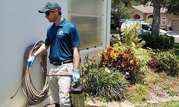 Man holding pesticide spray